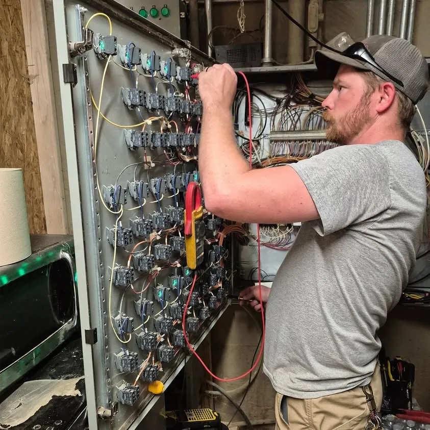 Wiring the control panel for a grain elevator operation in Aledo