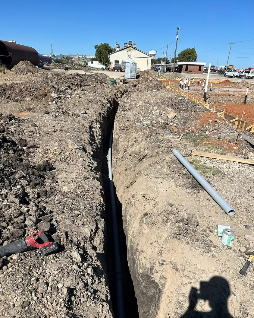 Trenching for underground conduit at a new commercial build in North Fort Worth